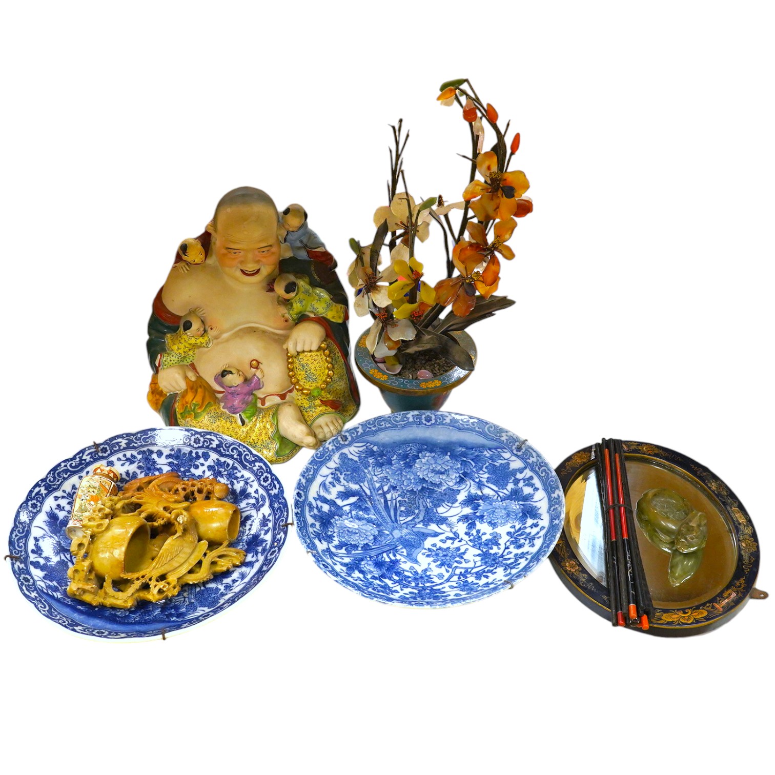 A collection of mostly Japanese and Chinese items including a floral hardstone flower in cloisonné pot, a hardstone carving of a Chinese Buddha and blue and white dishes. Condition - varies, fair